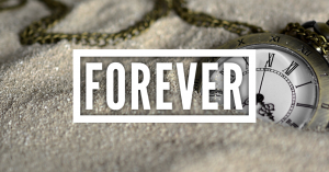 Forever with a clock half buried in sand